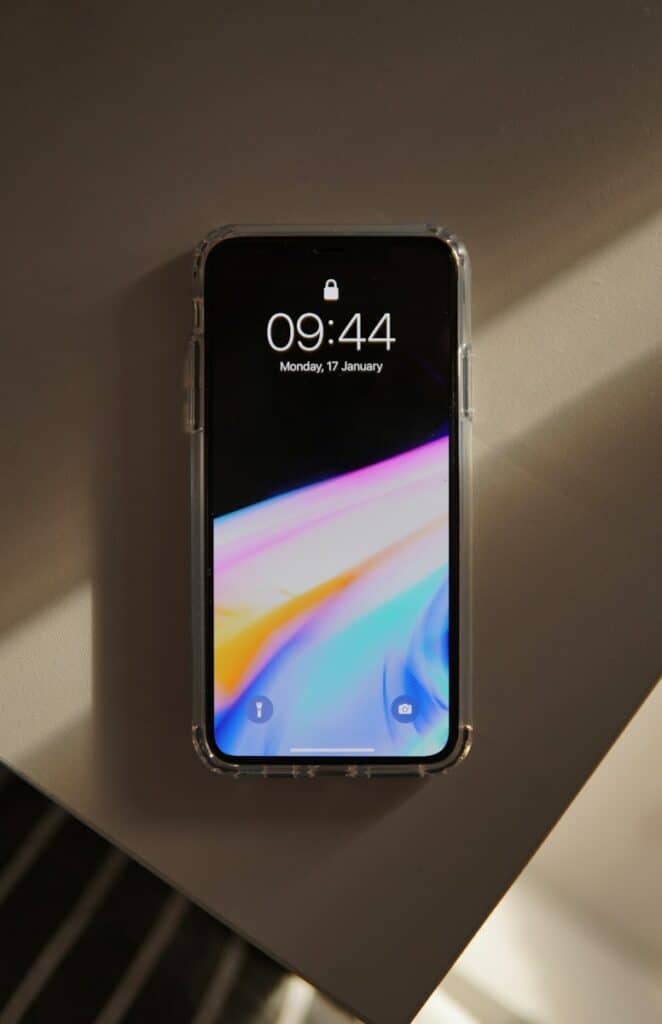 How to Lock Your iPhone 2 a cell phone sitting on top of a wall