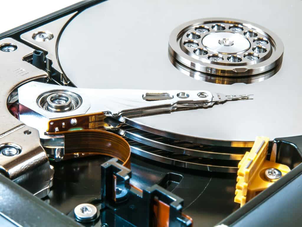 a close up of a hard drive with a pair of scissors