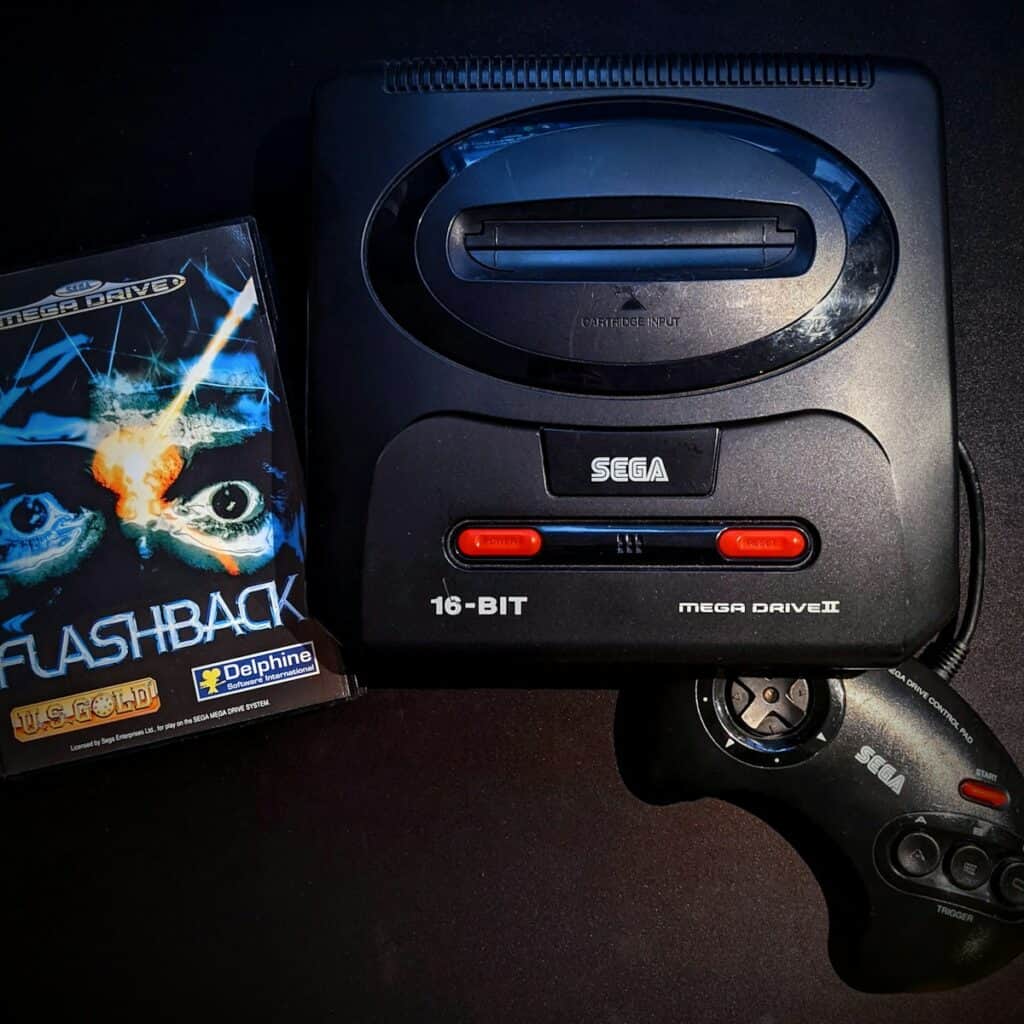 black and gray Sega game console
