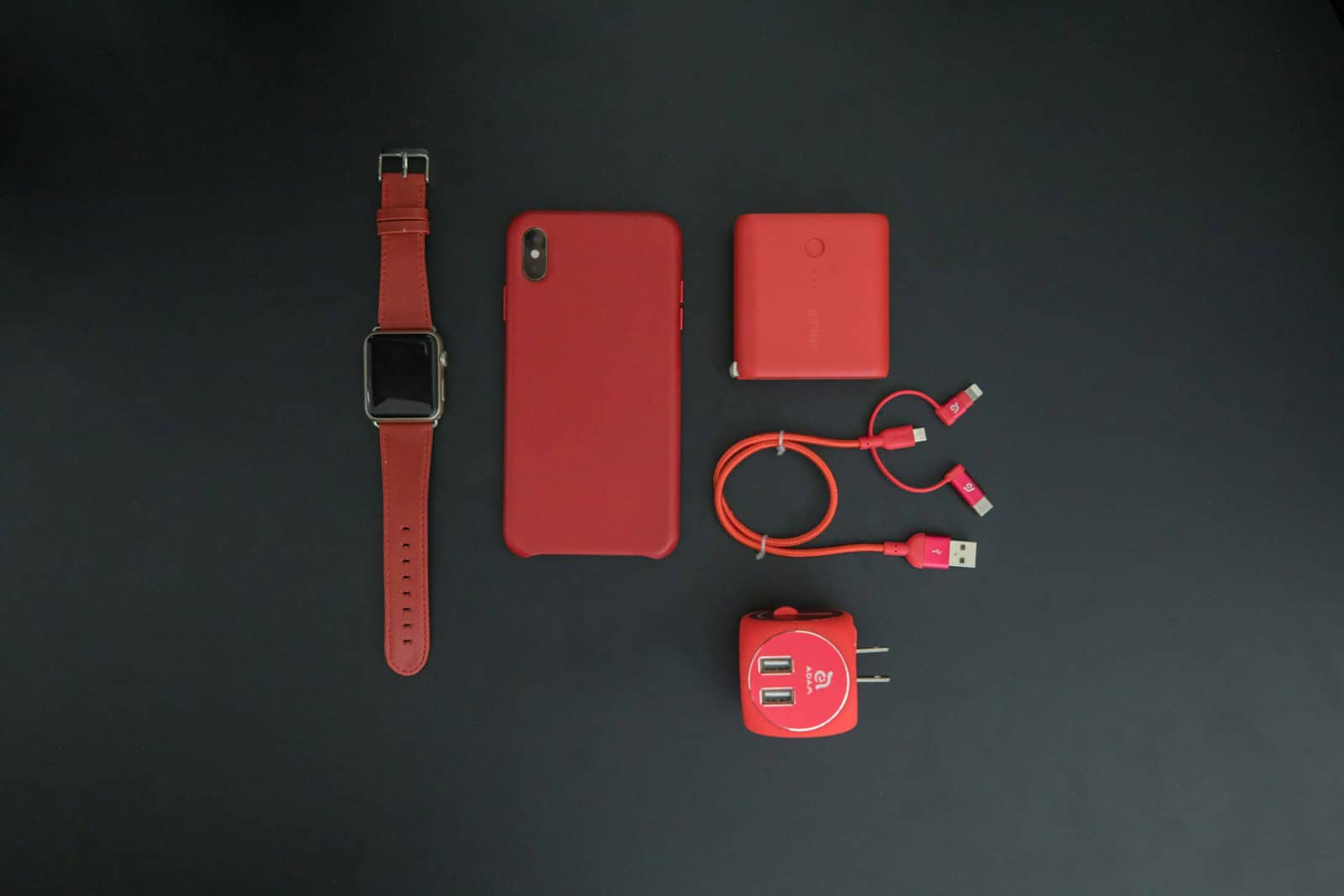 red iPhone and red smartwatch