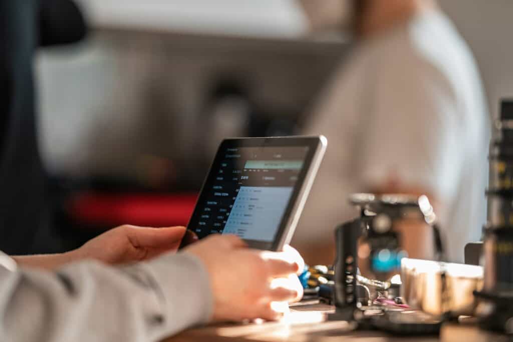 person holding black iPad