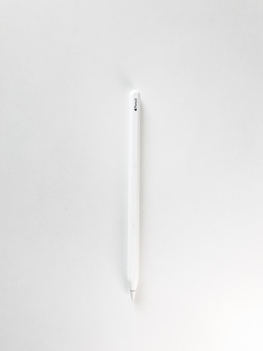 white pen on white surface