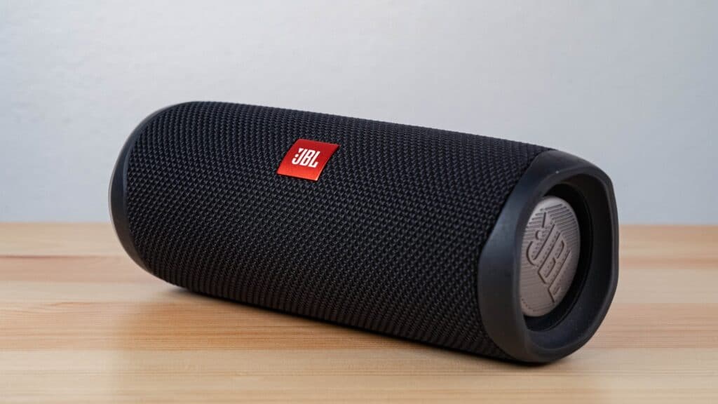 How to Connect Multiple Bluetooth Speakers at the Same Time 2 black jbl portable speaker on brown wooden table